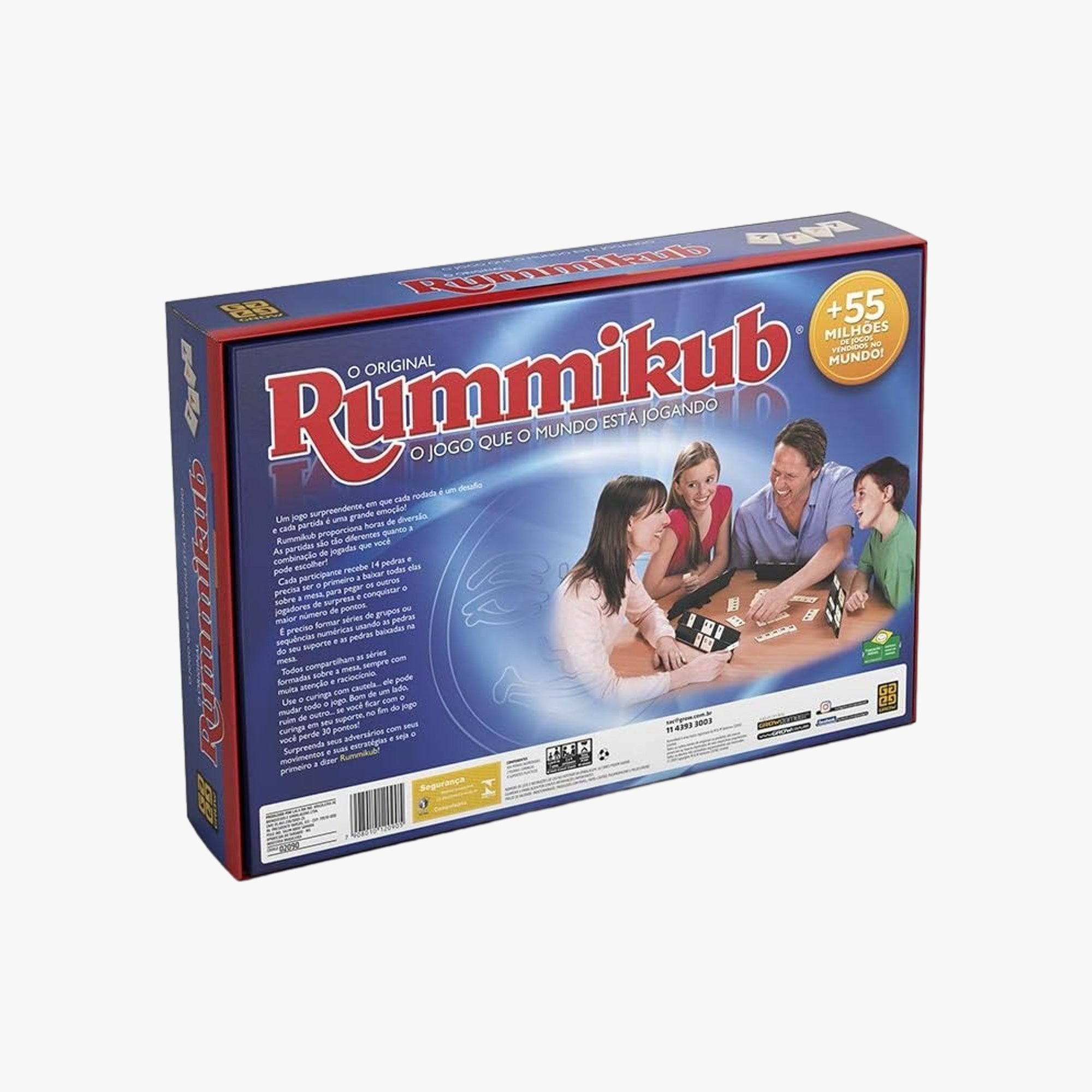 Vista interna da caixa do Rummikub com pedras, suportes e instrução de jogo